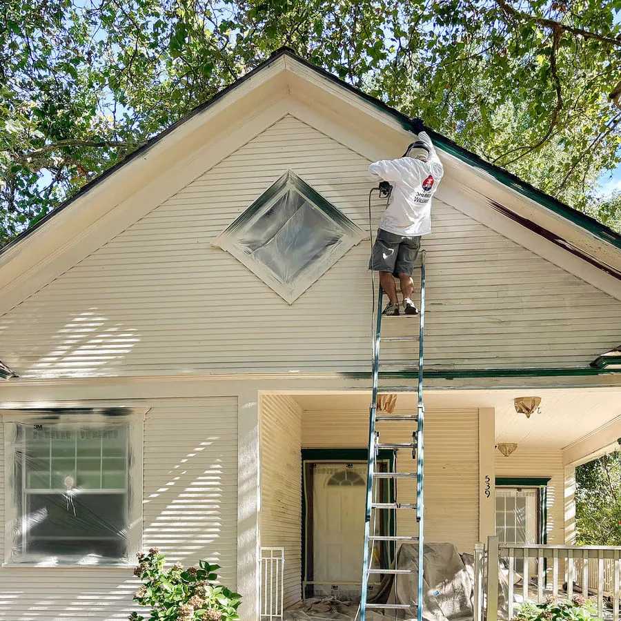 Painter working on a home exterior